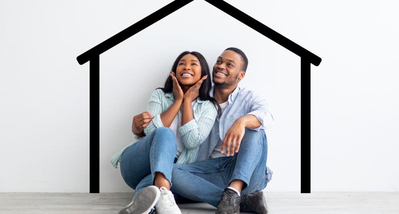 Couple sitting under outline drawing of home